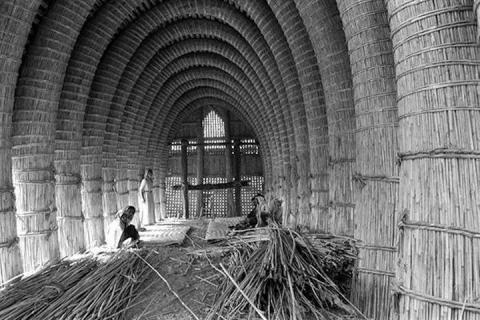 Interior view of an unfinished mudhif taken by Wilfred Thesiger