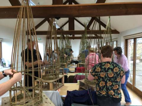 demonstrating willow weaving plant supports