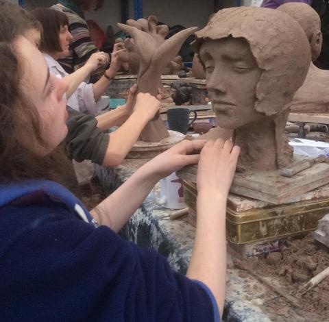 Teenager creating a medieval lady's head