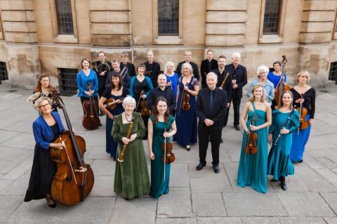 A band of classical musicians in front of the Sheldonian Theatre, Oxford