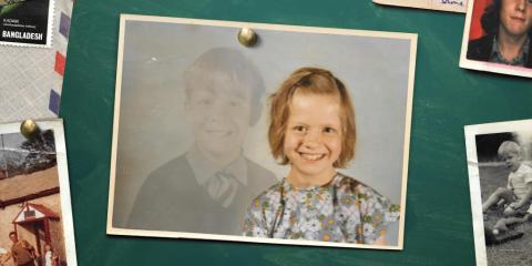 a picture of a young girl and a boy who barely visible, pinned on a notice board