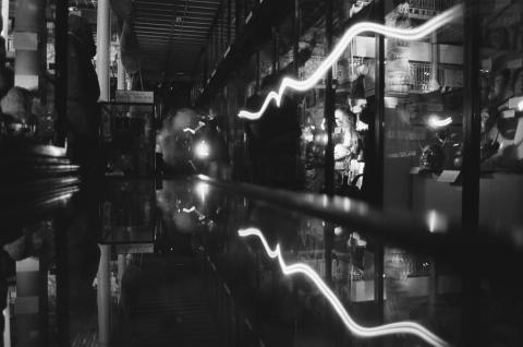 Black and white image of galleries with white wavy lines of light